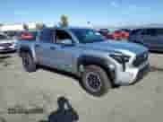 2024 Toyota Tacoma TRD Off Road with VIN 3TMLB5JN8RM000837, listed as a Copart auction lot 82183745 with 14,184 mi miles and Salvage title. Bid and sale history available at DreamBid. Image 4.