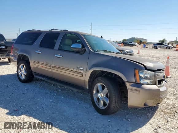 2014 Chevrolet Suburban LT with VIN 1GNSCJE05ER175420, listed as a Copart auction lot 91117505 with 165,340 mi miles and Salvage title. Bid and sale history available at DreamBid. Image 4.
