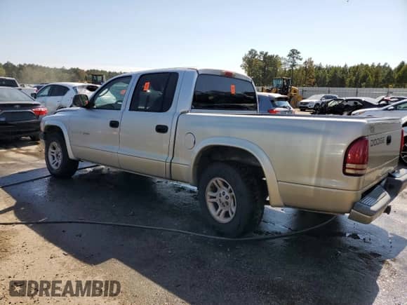 2002 Dodge Dakota Sport z VIN 1B7HL38N32S503296, wystawiony jako Copart lot #75428444 z przebiegiem 239 482 mil mil oraz Szkoda całkowita • Salvage title. Historia ofert i sprzedaży dostępna na DreamBid. Obrazek 2.