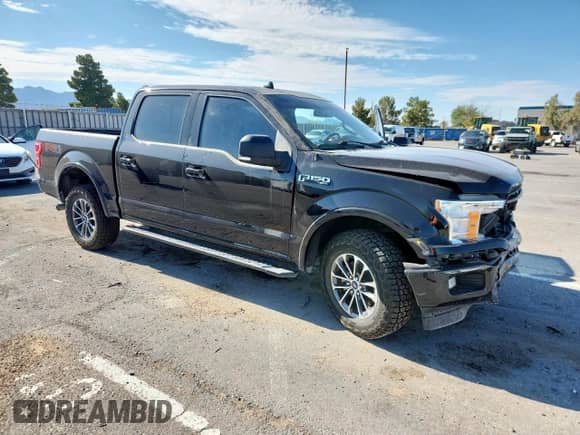 2020 Ford F-150 XL with VIN 1FTEW1E44LKD60628, listed as a Copart auction lot 62777675 with 96,121 mi miles and Salvage title. Bid and sale history available at DreamBid. Image 4.