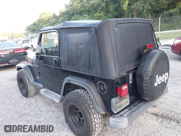 2001 Jeep Wrangler SE with VIN 1J4FA29P01P350847, listed as a IAAI auction lot 42821806 with 205,522 mi miles and . Bid and sale history available at DreamBid. Image 3.