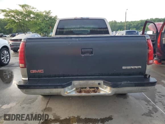 1998 GMC Sierra 1500 z VIN 1GTEC19W4WE517422, wystawiony jako Copart lot #65384335 z przebiegiem 263 184 mil mil oraz Czysty tytuł • Clean title. Historia ofert i sprzedaży dostępna na DreamBid. Obrazek 6.