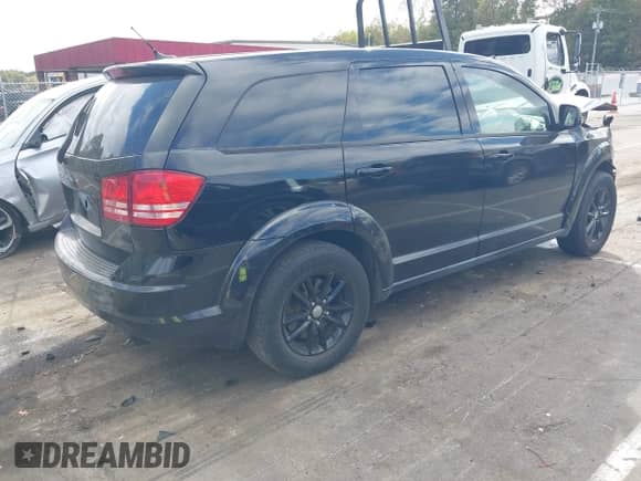 2015 Dodge Journey American Value z VIN 3C4PDCAB6FT531607, wystawiony jako IAAI lot #43454375 z przebiegiem 170 540 mil mil oraz . Historia ofert i sprzedaży dostępna na DreamBid. Obrazek 4.