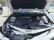 2021 Toyota Camry LE with VIN 4T1C11AK8MU601313, listed as a IAAI auction lot 43383218 with 34,384 mi miles and . Bid and sale history available at DreamBid. Image 10.