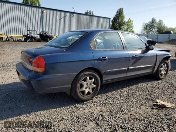 2001 Hyundai Sonata GLS z VIN KMHWF35V41A419720, wystawiony jako Copart lot #55110855 z przebiegiem 147 159 mil mil oraz Szkoda całkowita • Salvage title. Historia ofert i sprzedaży dostępna na DreamBid. Obrazek 3.