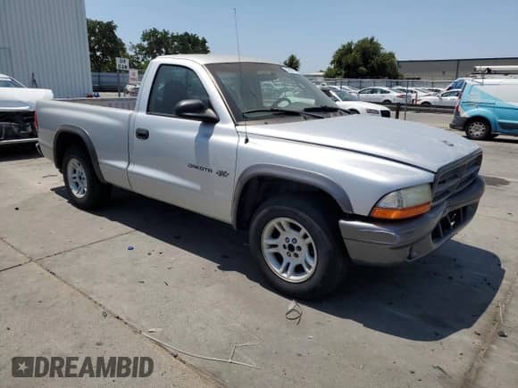2002 Dodge Dakota z VIN 1B7FL16X62S658103, wystawiony jako Copart lot #59591785 z przebiegiem 157 808 mil mil oraz Szkoda całkowita • Salvage title. Historia ofert i sprzedaży dostępna na DreamBid. Obrazek 4.