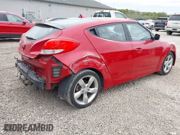 2013 Hyundai Veloster w/Black Int z VIN KMHTC6AD7DU129100, wystawiony jako IAAI lot #43459342 z przebiegiem 98 170 mil mil oraz . Historia ofert i sprzedaży dostępna na DreamBid. Obrazek 4.