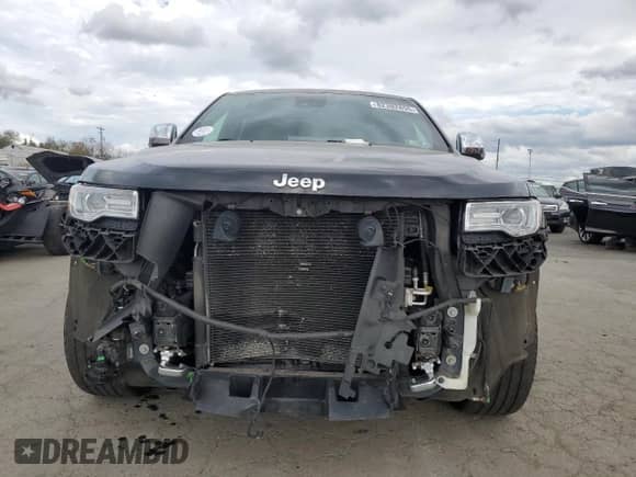 2016 Jeep Grand Cherokee Overland with VIN 1C4RJFCG6GC489769, listed as a Copart auction lot 82302855 with 136,225 mi miles and Salvage title. Bid and sale history available at DreamBid. Image 5.