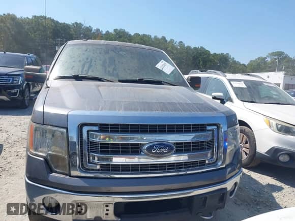 2013 Ford F-150 Lariat with VIN 1FTFW1ET5DFC93463, listed as a IAAI auction lot 43182949 with 133,397 mi miles and . Bid and sale history available at DreamBid. Image 12.