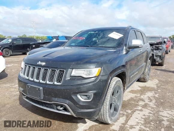 2015 Jeep Grand Cherokee Overland with VIN 1C4RJECG3FC841263, listed as a IAAI auction lot 43293918 with 158,583 mi miles and . Bid and sale history available at DreamBid. Image 2.
