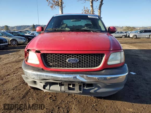 2001 Ford F-150 with VIN 2FTZX17281CA43267, listed as a Copart auction lot 85808284 with 324,614 mi miles and Salvage title. Bid and sale history available at DreamBid. Image 5.