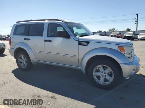 2011 Dodge Nitro SXT with VIN 1D4PU5GKXBW579119, listed as a Copart auction lot 84003925 with 185,345 mi miles and Salvage title. Bid and sale history available at DreamBid. Image 4.