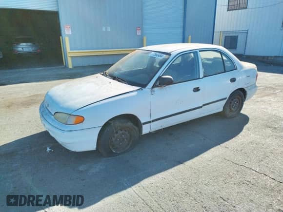 1997 Hyundai Accent GL z VIN KMHVF24NXVU373676, wystawiony jako Copart lot #77866484 z przebiegiem 151 949 mil mil oraz Czysty tytuł • Clean title. Historia ofert i sprzedaży dostępna na DreamBid. Obrazek 1.