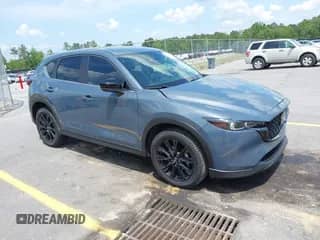 2022 Mazda CX-5 S Preferred z VIN JM3KFBCM9N0584253, wystawiony jako IAAI lot #42142889 z przebiegiem 77 104 mil mil oraz . Historia ofert i sprzedaży dostępna na DreamBid. Obrazek 1.