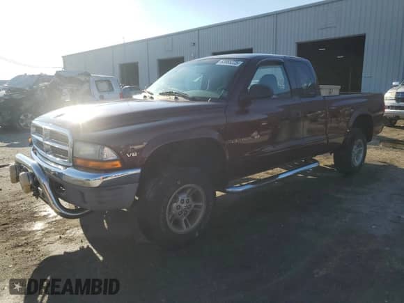 2000 Dodge Dakota Sport with VIN 1B7GG22N4YS610725, listed as a Copart auction lot 83965225 with 128,401 mi miles and Salvage title. Bid and sale history available at DreamBid. Image 1.