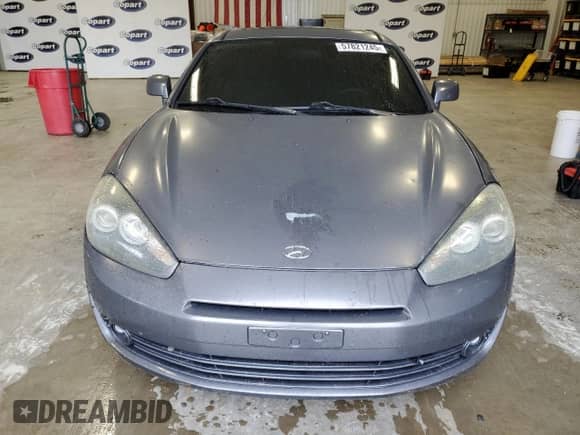2007 Hyundai Tiburon GS с VIN KMHHM66D57U261613, выставлен на аукционе Copart как лот 57821245 с пробегом 185 489 миль миль и Списание • Salvage title. История ставок и продаж доступна на DreamBid. Изображение 5.