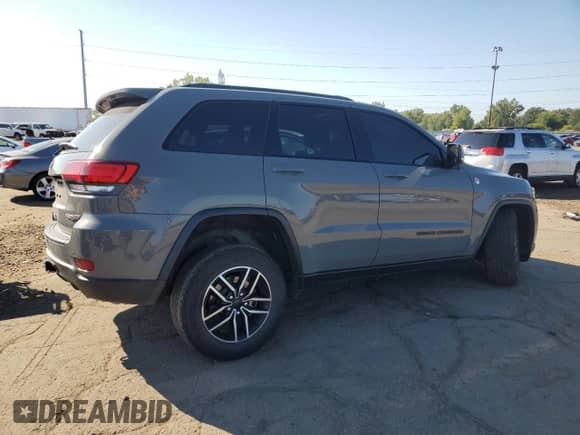 2021 Jeep Grand Cherokee Trailhawk z VIN 1C4RJFLG5MC770179, wystawiony jako Copart lot #71072165 z przebiegiem 51 677 mil mil oraz Czysty tytuł • Clean title. Historia ofert i sprzedaży dostępna na DreamBid. Obrazek 3.