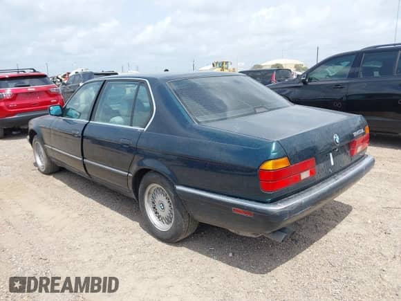 1994 BMW 7 Series with VIN WBAGD8329RDE92628, listed as a IAAI auction lot 42177332 with 176,179 mi miles and . Bid and sale history available at DreamBid. Image 3.