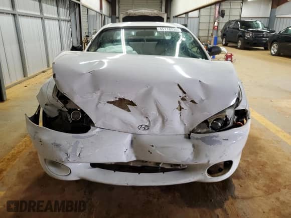 1997 Hyundai Tiburon с VIN KMHJG24M6VU052589, выставлен на аукционе Copart как лот 45118235 с пробегом 90 609 миль миль и Списание • Salvage title. История ставок и продаж доступна на DreamBid. Изображение 5.