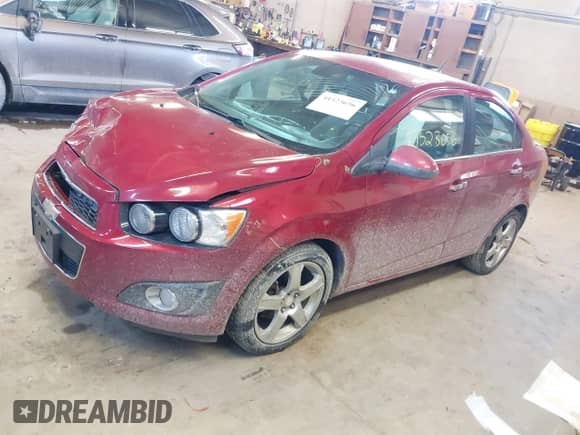 2014 Chevrolet Sonic LTZ with VIN 1G1JE5SB5E4225847, listed as a IAAI auction lot 41523656 with 118,489 mi miles and . Bid and sale history available at DreamBid. Image 2.