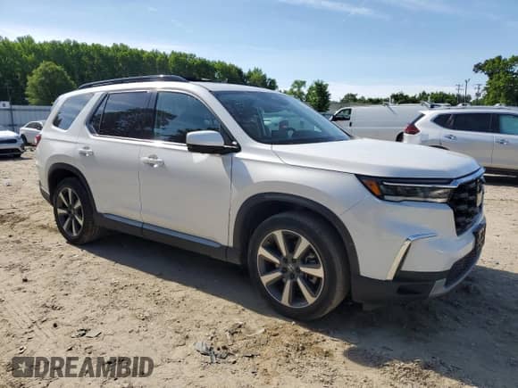 2023 Honda Pilot Elite with VIN 5FNYG1H82PB024617, listed as a Copart auction lot 55943805 with 53,461 mi miles and Salvage title. Bid and sale history available at DreamBid. Image 4.