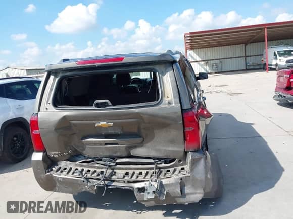 2015 Chevrolet Tahoe LTZ with VIN 1GNSCCKC1FR599320, listed as a IAAI auction lot 43093837 with 124,751 mi miles and . Bid and sale history available at DreamBid. Image 16.