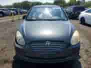 2006 Hyundai Accent GLS z VIN KMHCN46C86U016919, wystawiony jako Copart lot #68276735 z przebiegiem 131 346 mil mil oraz Szkoda całkowita • Salvage title. Historia ofert i sprzedaży dostępna na DreamBid. Obrazek 5.