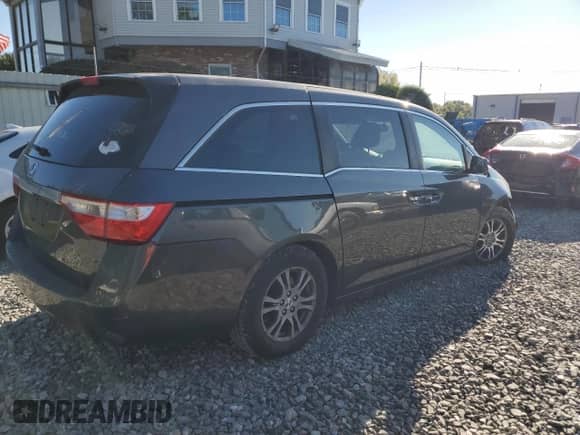 2013 Honda Odyssey EX-L z VIN 5FNRL5H68DB058191, wystawiony jako Copart lot #85085505 z przebiegiem 168 828 mil mil oraz Czysty tytuł • Clean title. Historia ofert i sprzedaży dostępna na DreamBid. Obrazek 3.