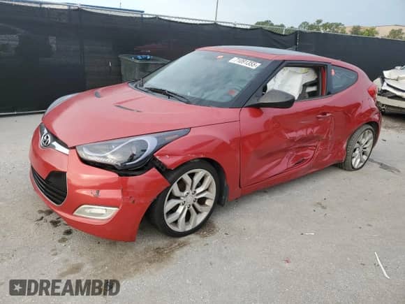2012 Hyundai Veloster w/Red Int z VIN KMHTC6AD1CU070298, wystawiony jako Copart lot #71091355 z przebiegiem 144 305 mil mil oraz Czysty tytuł • Clean title. Historia ofert i sprzedaży dostępna na DreamBid. Obrazek 1.