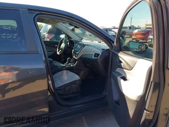 2021 Chevrolet Equinox LS z VIN 2GNAXHEV1M6136760, wystawiony jako IAAI lot #43276426 z przebiegiem 74 766 mil mil oraz . Historia ofert i sprzedaży dostępna na DreamBid. Obrazek 5.