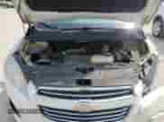 2015 Chevrolet Trax LTZ z VIN KL7CJTSB3FB189229, wystawiony jako Copart lot #68121215 z przebiegiem 121 017 mil mil oraz Szkoda całkowita • Salvage title. Historia ofert i sprzedaży dostępna na DreamBid. Obrazek 12.