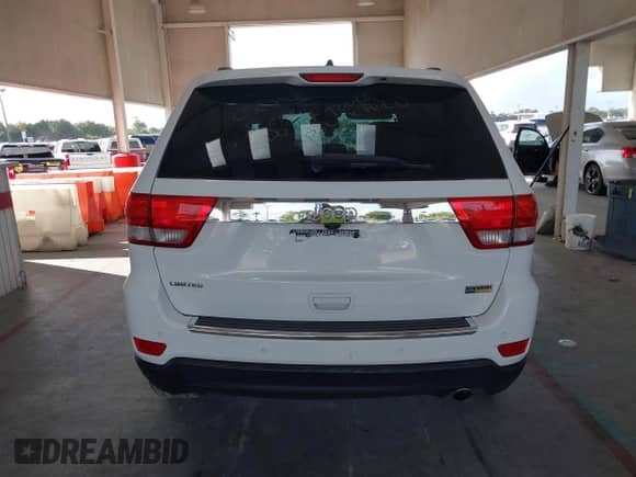 2013 Jeep Grand Cherokee Limited z VIN 1C4RJEBG6DC595730, wystawiony jako IAAI lot #43418036 z przebiegiem 163 431 mil mil oraz . Historia ofert i sprzedaży dostępna na DreamBid. Obrazek 16.