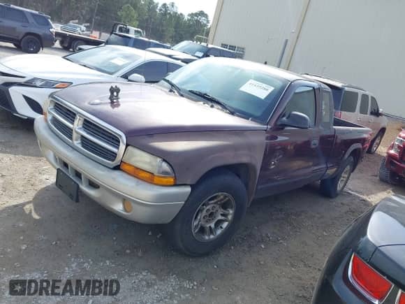 2004 Dodge Dakota SLT с VIN 1D7GL42K14S565403, выставлен на аукционе IAAI как лот 41439288 с пробегом 235 421 миль миль и . История ставок и продаж доступна на DreamBid. Изображение 2.