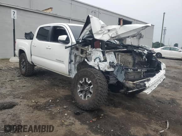 2018 Toyota Tacoma TRD Off Road with VIN 3TMCZ5ANXJM138363, listed as a Copart auction lot 84400805 with 95,418 mi miles and Salvage title. Bid and sale history available at DreamBid. Image 4.