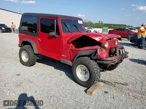 1995 Jeep Wrangler S with VIN 1J4FY19P5SP239735, listed as a Copart auction lot 82158285 with 128,976 mi miles and Salvage title. Bid and sale history available at DreamBid. Image 14.