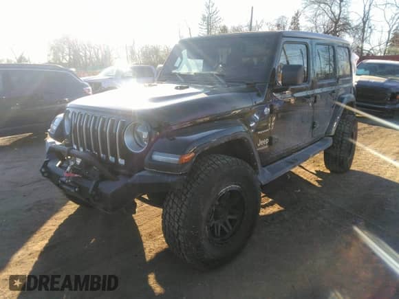 2021 Jeep Wrangler Unlimited Sahara with VIN 1C4HJXEG1MW579887, listed as a IAAI auction lot 41299338 with 50,707 mi miles and . Bid and sale history available at DreamBid. Image 2.