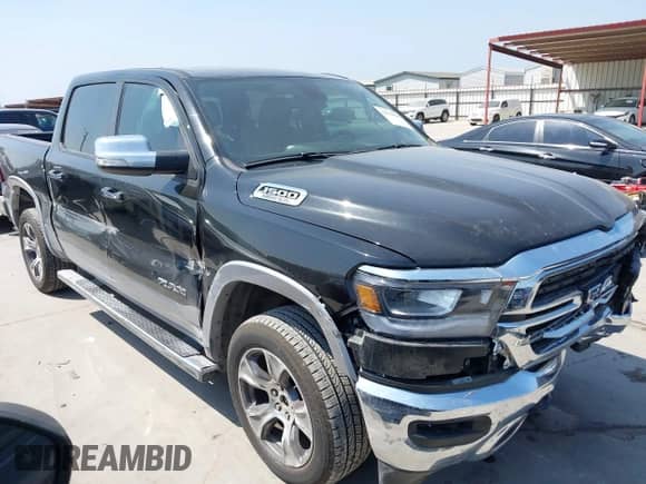 2020 Ram 1500 Laramie with VIN 1C6SRFJT0LN323862, listed as a IAAI auction lot 42325646 with 81,520 mi miles and . Bid and sale history available at DreamBid. Image 1.