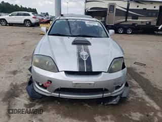 2006 Hyundai Tiburon GS с VIN KMHHM65D66U226482, выставлен на аукционе Copart как лот 64059334 с пробегом 93 932 миль миль и Списание • Salvage title. История ставок и продаж доступна на DreamBid. Изображение 5.