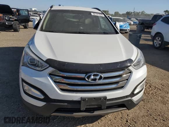 2014 Hyundai Santa Fe с VIN 5XYZU3LBXEG222654, выставлен на аукционе Copart как лот 82161845 с пробегом 174 018 миль миль и Списание • Salvage title. История ставок и продаж доступна на DreamBid. Изображение 5.