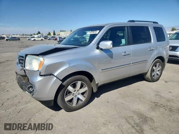 2012 Honda Pilot Touring with VIN 5FNYF3H98CB019682, listed as a Copart auction lot 71929055 with 120,705 mi miles and Salvage title. Bid and sale history available at DreamBid. Image 1.
