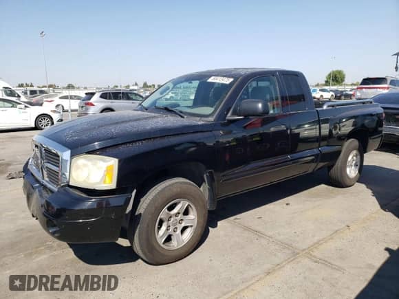 2005 Dodge Dakota SLT с VIN 1D7HE42N65S163225, выставлен на аукционе Copart как лот 80413475 с пробегом 137 282 миль миль и Списание • Salvage title. История ставок и продаж доступна на DreamBid. Изображение 1.