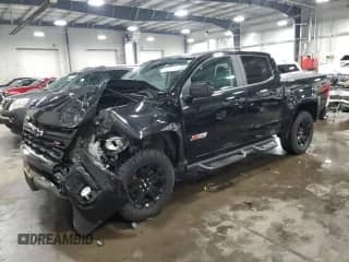 2021 Chevrolet Colorado 4WD Z71 with VIN 1GCGTDEN8M1171810, listed as a Copart auction lot 57409115 with 100,579 mi miles and Salvage title. Bid and sale history available at DreamBid. Image 1.