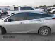 2021 Toyota Prius L Eco with VIN JTDKAMFUXM3143243, listed as a IAAI auction lot 43079577 with 87,002 mi miles and . Bid and sale history available at DreamBid. Image 13.