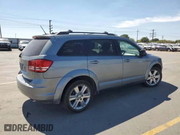 2009 Dodge Journey SXT with VIN 3D4GH57V99T171841, listed as a Copart auction lot 68777785 with 169,668 mi miles and Salvage title. Bid and sale history available at DreamBid. Image 3.