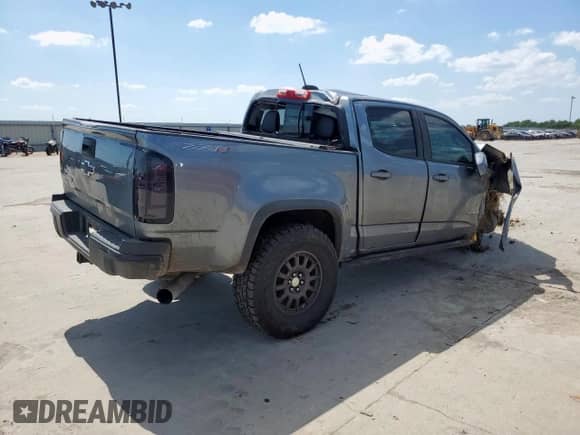 2018 Chevrolet Colorado 4WD ZR2 with VIN 1GCPTEE11J1243686, listed as a Copart auction lot 58235125 with 144,760 mi miles and Salvage title. Bid and sale history available at DreamBid. Image 3.