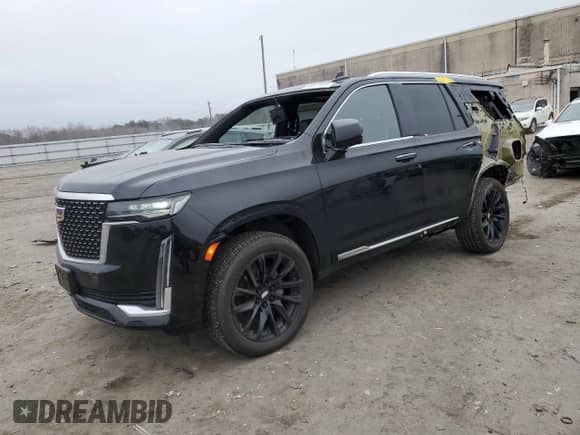 2021 Cadillac Escalade Premium Luxury with VIN 1GYS4BKL9MR215159, listed as a Copart auction lot 48577415 with 50,773 mi miles and Salvage title. Bid and sale history available at DreamBid. Image 1.