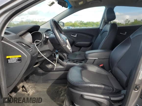 2012 Hyundai Tucson GLS with VIN KM8JUCAC0CU397835, listed as a Copart auction lot 82072965 with 69,457 mi miles and Salvage title. Bid and sale history available at DreamBid. Image 7.