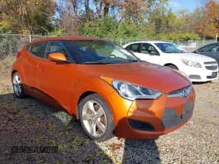 2012 Hyundai Veloster w/Red Int z VIN KMHTC6AD8CU065650, wystawiony jako IAAI lot #43576272 z przebiegiem 147 621 mil mil oraz . Historia ofert i sprzedaży dostępna na DreamBid. Obrazek 1.