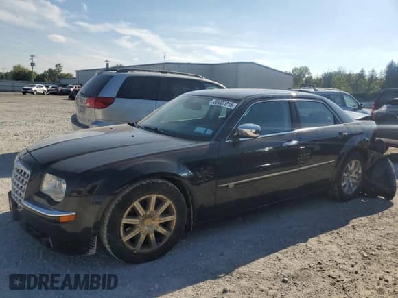 2009 Chrysler 300 C Hemi with VIN 2C3KA63T19H571475, listed as a Copart auction lot 80807015 with 142,846 mi miles and Salvage title. Bid and sale history available at DreamBid. Image 1.