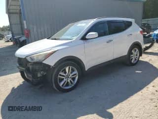 2015 Hyundai Santa Fe с VIN 5XYZW4LA4FG275780, выставлен на аукционе Copart как лот 70886225 с пробегом 106 500 миль миль и Списание • Salvage title. История ставок и продаж доступна на DreamBid. Изображение 1.